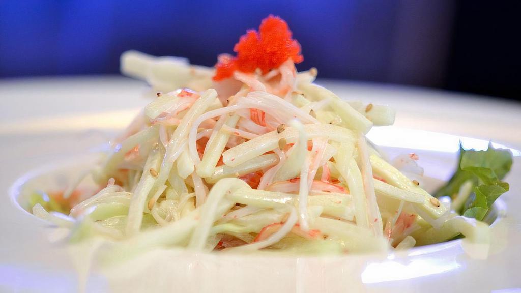 Kani Salad · Cucumber, Kani, mix green on the bottom mixed with mayo. some caviar on top