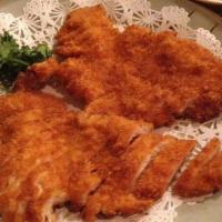 Chicken Katsu · Crispy fried cutlet of Chicken with flaky Japanese panko breadcrumbs. with katsu sauce on th...
