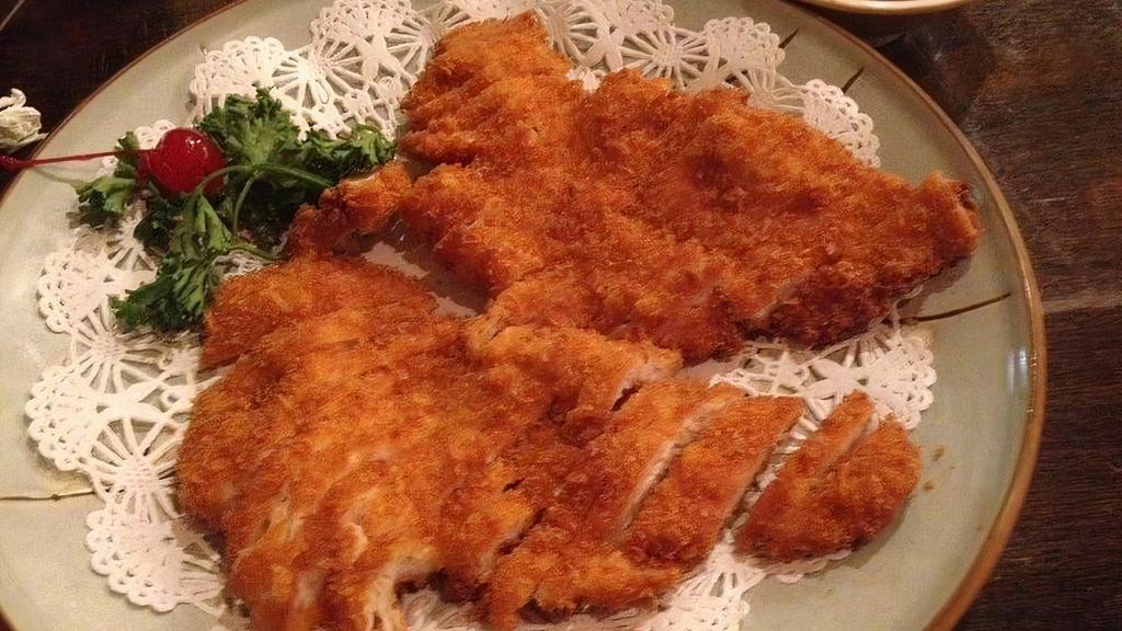 Chicken Katsu · Crispy fried cutlet of Chicken with flaky Japanese panko breadcrumbs. with katsu sauce on the side.