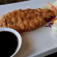 Pork Katsu · Crispy fried cutlet of Pork with flaky Japanese panko breadcrumbs. with katsu sauce on the s...