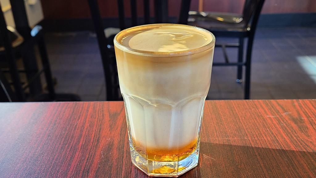 Layered Espresso · A double shot of espresso with layers of your choice of housemade syrup and milk.