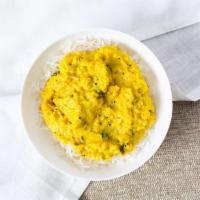 Dal Tadka · Gluten-Free. Vegan. Vegetarian. Yellow lentils tempered with ghee, herbs and spices.
