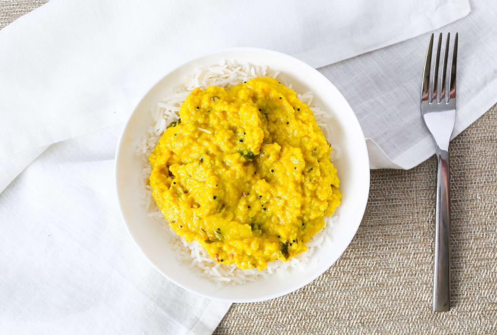 Dal Tadka · Gluten-Free. Vegan. Vegetarian. Yellow lentils tempered with ghee, herbs and spices.