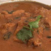 Chicken Korma · Gluten-Free. Tender pieces of chicken cooked with cashews, onions, tomatoes in a rich creamy...