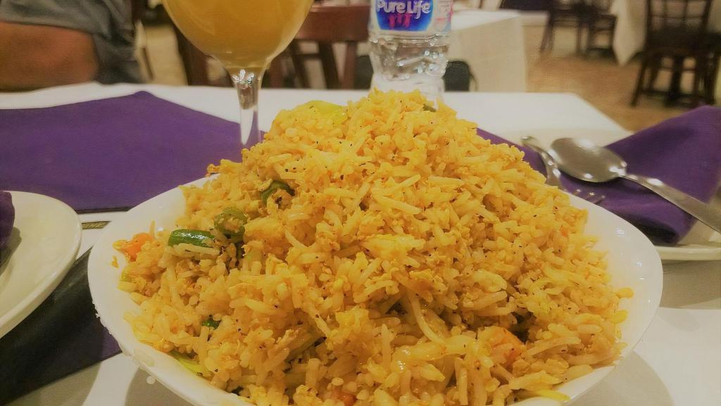 Vegetable Dum Biryani · Vegetarian. Gluten-free. Spicy. Basmati rice cooked with a variety of fresh seasonal vegetables, blended with herbs and spices.