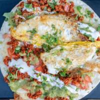 Soy Chorizo With Egg Quesadilla · Made with flour tortilla fried egg onion tomato cilantro salsa verde and fresh crema