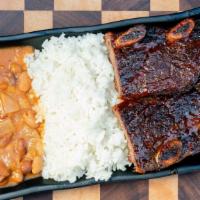 Bbq Beef Short Ribs · Slow Cooked Sweet and Spicy Short Ribs
Served with choice of: White Rice and Beans or French...