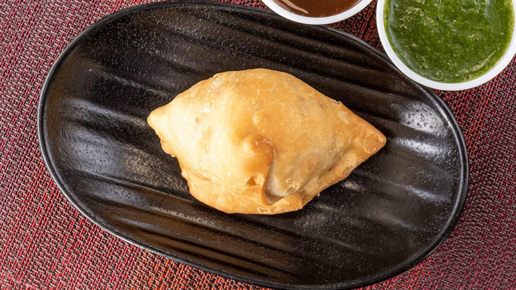 Vegetable Samosa · Crisp delicate parties with potatoes, peas and fine herbs.