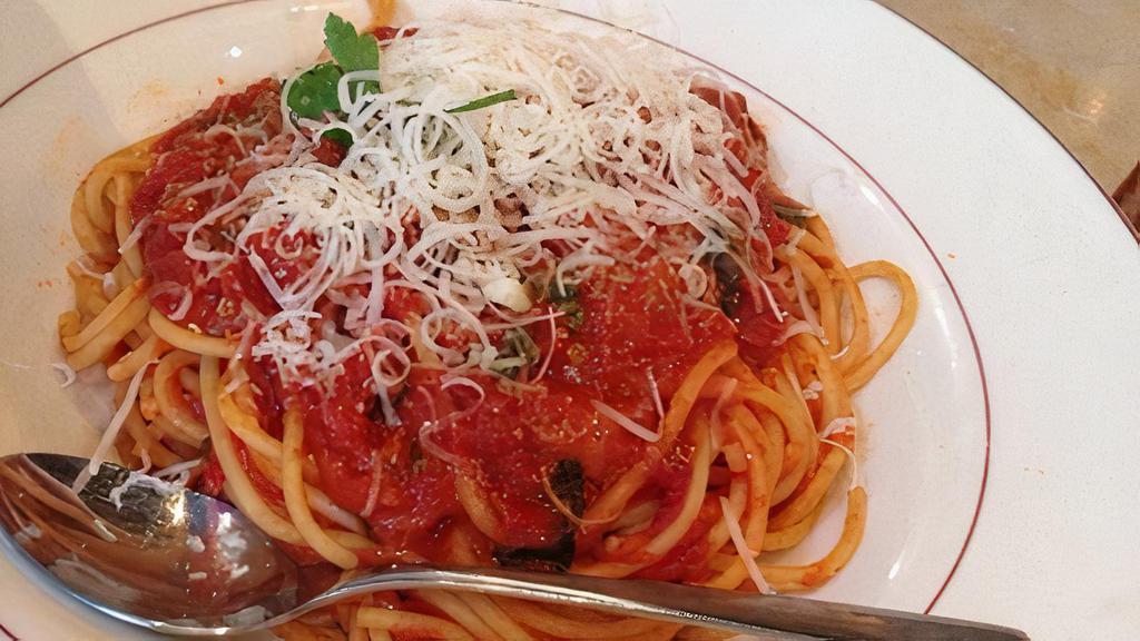 Spaghetti Al Pomodoro E Basilico · Spaghetti with fresh plum tomato sauce.