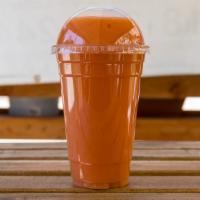 Tropical Breeze · Pineapple, papaya, banana, strawberry, mango, and coconut water.