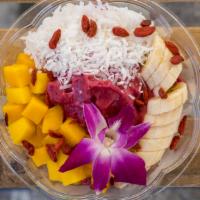 Pitaya Bowl · Soy milk with pitaya, banana, and strawberries as base. On top coconut flakes, mango, banana...