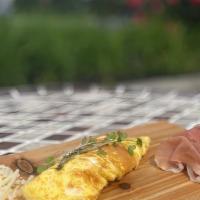 Simple 3 Egg Omelet · Three lima farm egg omelet served with two pieces of focaccia.