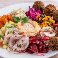 Falafa Plate Small · Gluten free, vegetarian. Four falafel balls placed on a variety of salads finished with humm...