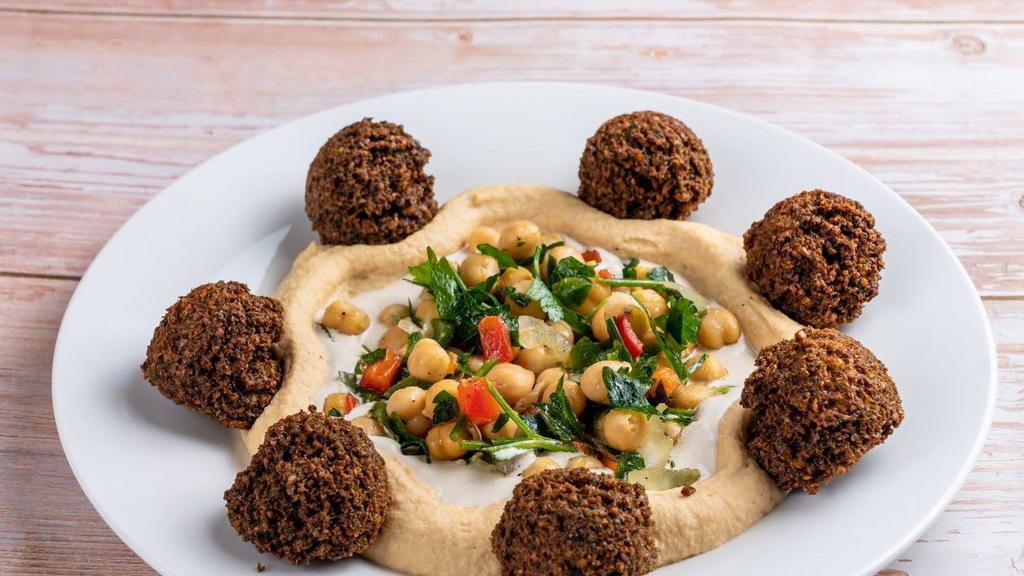 Hummus Plate · Gluten free, vegetarian. Hummus, chickpea salad, tehina, six falafel balls, drizzled with olive oil.