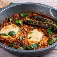 Shakshuka Plate · Two poached eggs in spicy Israeli salsa served with salad and Pita