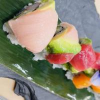Rainbow Roll (8) · Tuna Salmon,Yellowtail,White Fish and Avocado over California Roll