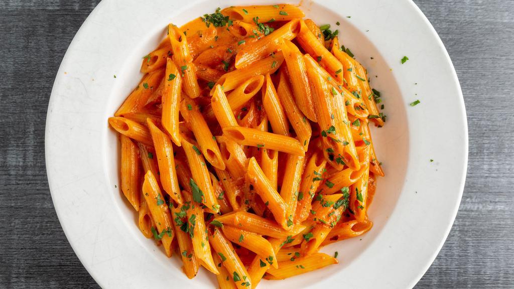Penne Alla Vodka · Pink sauce with onions and prosciutto.