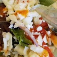Greek Salad · Crisp romaine lettuce topped with tomatoes, cucumbers, green peppers, red onions, olives, an...