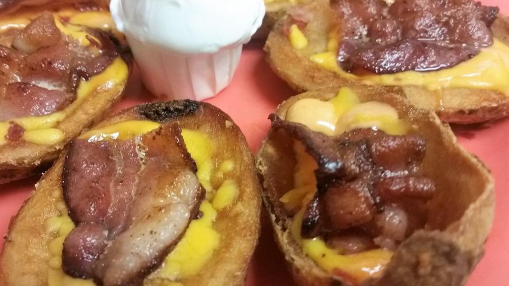 Green Acres Potato Skins · Topped with cheddar cheese, tomato aioli and bacon, with a side of sour cream.