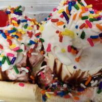 Banana Split · Ice cream served on a banana sliced in half lengthwise. Choice of topping, choice of syrup. ...