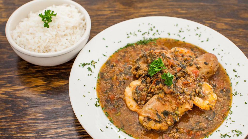 Xinxim De Galinha · Bahia's organic chicken and shrimp stew with tomatoes, cilantro and onions served with white rice