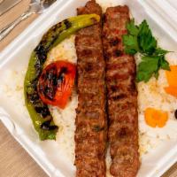 Adana Kebab · Ground lamb and beef meat. Served with mixed onion and parsley as a garniture, and rice or b...