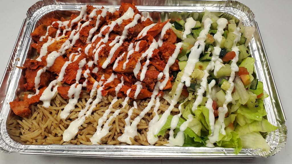 Chicken Platter · Served over brown basmati with choice of salad and sauce.