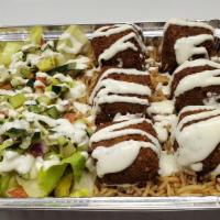 Falafel Platter · Served over brown basmati with choice of salad and sauce.