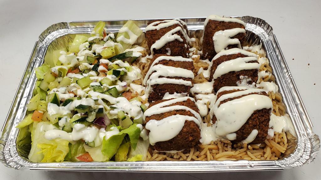 Falafel Platter · Served over brown basmati with choice of salad and sauce.