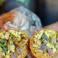 The Nuritta Breakfast Burrito · Organic Eggs, Sautéed Greens, Mushrooms, Black Beans, Jalapeños, Belle Papers on a Tomato Ba...