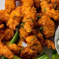 Buffalo Shrimp Bites · 1/3rd of a Pound Hand Battered Shrimp Bites tossed in our House Made Buffalo Sauce, Served w...