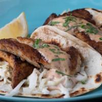 Fish Tacos (2 Per Order) · Two Blackened Pollock Flour Tacos topped with Coleslaw & House Remoulade.