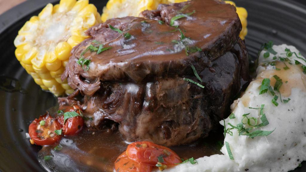 Beef Short Ribs · Over a Half Pound of Slowed Cooked, Fork Tender, Beef Short Ribs Topped with Pan Sauce . Served with Your Choice of Sides