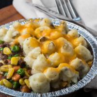 Shepard'S Pie · Personal-Sized Pie stuffed with Ground Beef, Corn, Peas, Carrots and topped with Fresh Whipp...