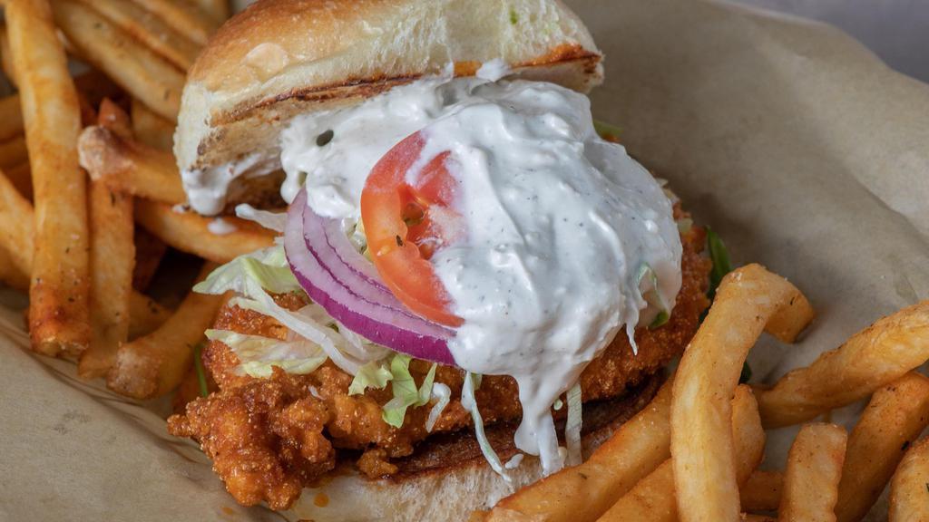 Buffalo Chicken Sandwich · 6oz Fresh Chicken, Hand Battered and Flash Fried to perfection, tossed in our House Made Buffalo Sauce, served on a Hudson Bakery, Parker House, Butter Toasted Bun topped with Shredded Iceberg Lettuce, Sliced Tomatoes, Shaved Red Onions, and our House Made Blue Cheese Dressing.