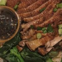 Khao Nar Ped · Thai style roasted duck over with Chinese broccoli.