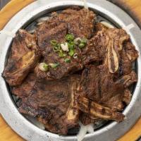 Beef Short Ribs · Marinated beef short ribs in a special house sauce.