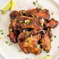 Jerk Wings · 6 pieces served with choice of dip (blue cheese /ranch/jerk sauce), celeries and carrots.