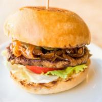 Hamburger · 8 oz. all beef patty served on a bun and topped with saute onions, lettuce, tomatoes and sau...