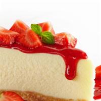 Cheesecake · Delicious cheese cake topped with strawberries.