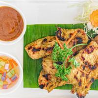 Chicken Satay · Marinated chicken tender with coconut milk and curry powder served with peanut sauce and cuc...