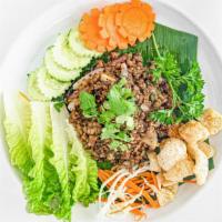 Larb Salad · Ground chicken or ground pork with mints, cilantro, tomatoes, onions, roasted rice, chili, l...