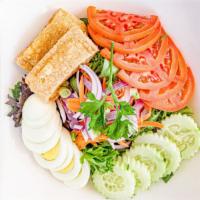 Thai Salad · Spring mixed, cucumber, tomatoes, carrots, boiled egg, fried tofu with peanut sauce.