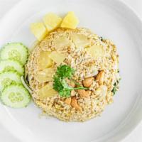 Pineapple Fried Rice · Pineapple chunks, cashew nuts, onions,  scallions and egg.