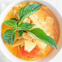 Red Curry · Bamboo shoot,pineapple,tomatoes , basil,  in creamy coconut red curry.