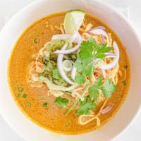  Khao Soi · A mild, coconut based in chiang mai, curry soop with chicken over soft egg noodle, served wi...