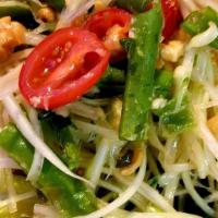 Som Tam Salad · Shredded green papaya, tomato, string beans, peanut, fresh chili, garlic and lime.