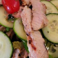 Yum Moo Yang Salad · Grilled pork, tomato, cucumber, red onion, scallion, lemongrass, chili and lime. Hot and spi...