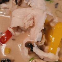 Tom Kha · Hot-sour coconut milk soup with, Chicken mushrooms, bell pepper, white onion, galanga, lemon...
