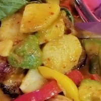 Salmon Yellow Curry · Grilled Salmon steak with potatoes, bell pepper, onion and fresh basil in a chili coconut sa...